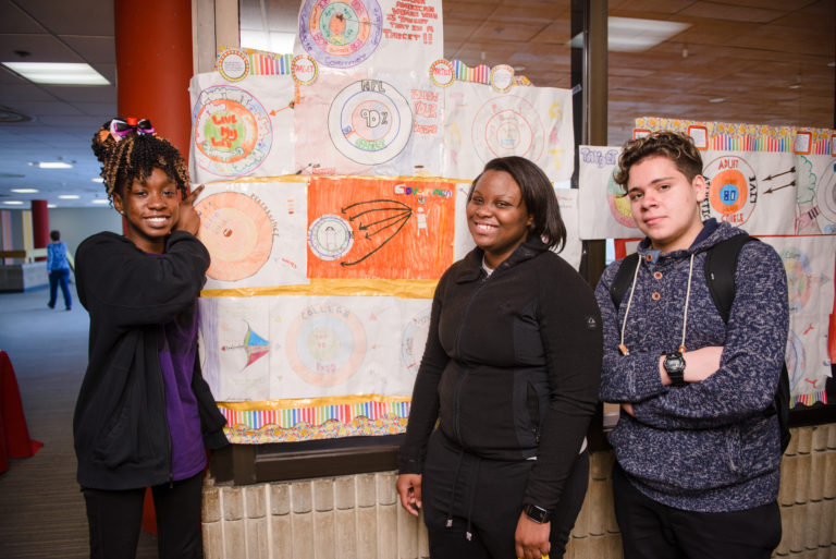 Students from Paolo Freire Charter School in Newark display artwork examining the closing of their school.